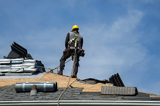 Professional Roofing technician working in Huntsville, AR